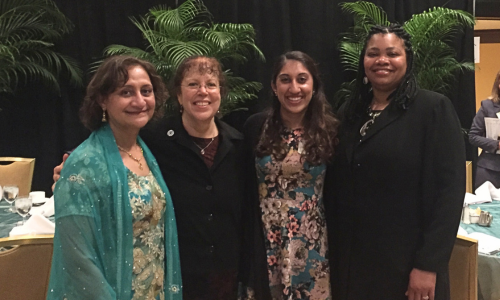 Dr. Esch at an awards ceremony with friends.